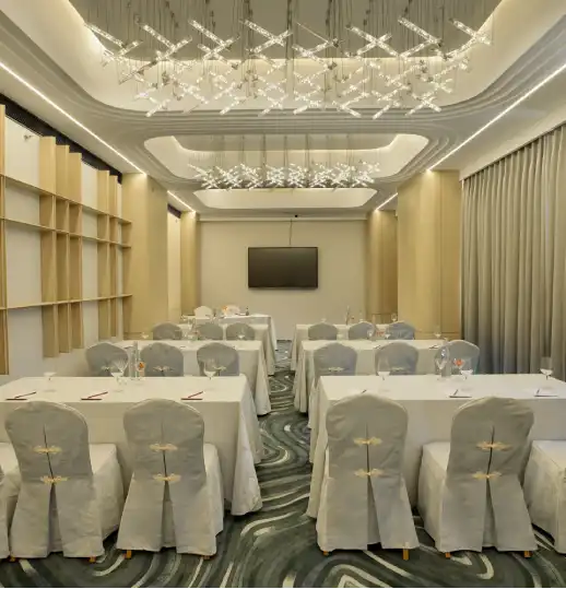Senate Hall – Sophisticated Venue for Conferences, Seminars, and Celebrations Modern conference or banquet hall setup with elegant interiors and professional ambiance