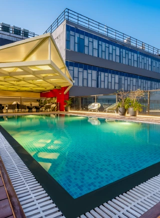 Relaxing poolside at Orchid Hotel Chandigarh Zirakpur offering comfort and luxury – best hotel stay in Chandigarh for leisure travelers