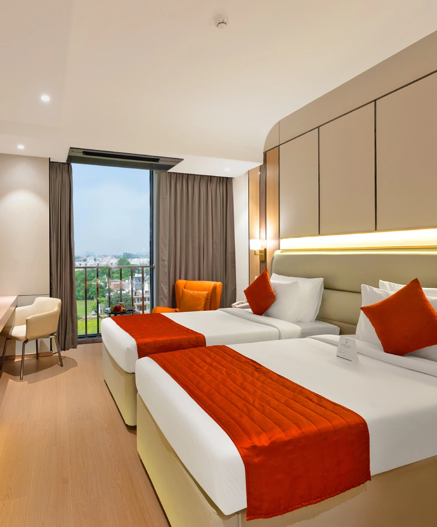 Deluxe Twin Room at Orchid Hotel Chandigarh Zirakpur with twin beds – perfect hotel room in Chandigarh for friends, colleagues and corporate stays, book now