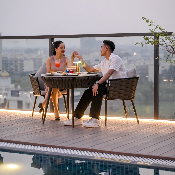 Night ambience at Skydip rooftop restaurant Chandigarh with lights music and fine dining setup – reserve romantic dinner online