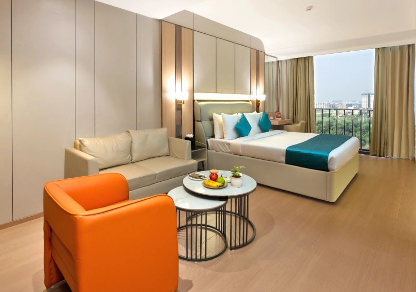 Club Room amenities at Orchid Hotel Chandigarh including cozy bedding and modern facilities – book hotel room online