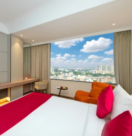 Book Deluxe Room with city view at Orchid Hotel Chandigarh – Premium stay near Chandigarh Deluxe Room with large windows and city view at Orchid Hotel Chandigarh Zirakpur – luxury stay booking