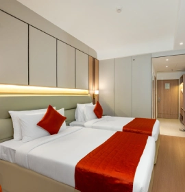 Spacious Deluxe Twin Room bedroom with two single beds at Orchid Hotel Chandigarh Zirakpur – reserve hotel room online