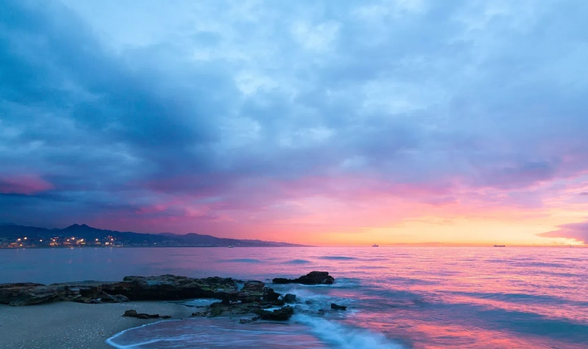 Dusk at beach with blue sky