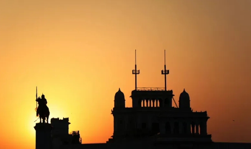 Palace silhouette during a sunset in Jamnagar with orange hues in the sky
