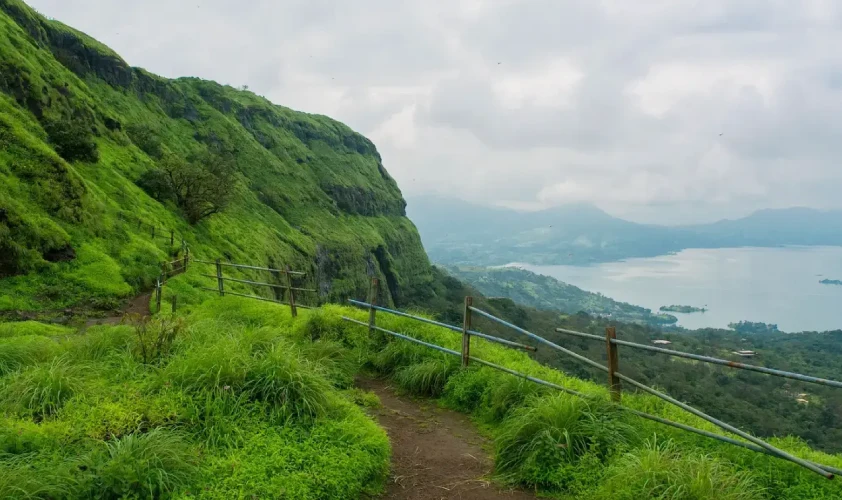 Trekking Trails in Lonavala Hills Trekking path in Lonavala with grassy hills and mountains in the background