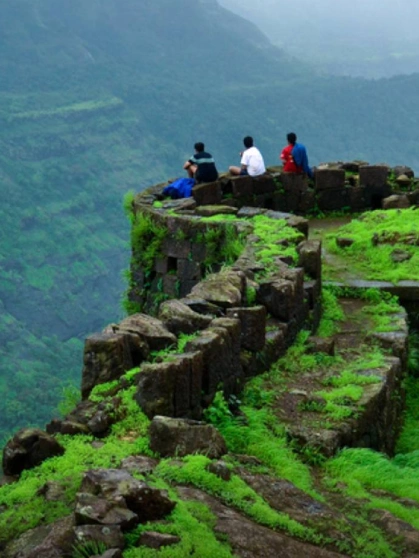 Rajmachi Fort Trek - Lonavala Adventure Rajmachi Fort trekking trail surrounded by lush valleys