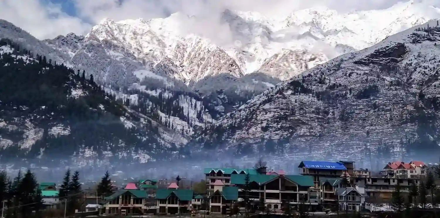 The Orchid Hotel Manali surrounded by Himalayan mountains and valley views