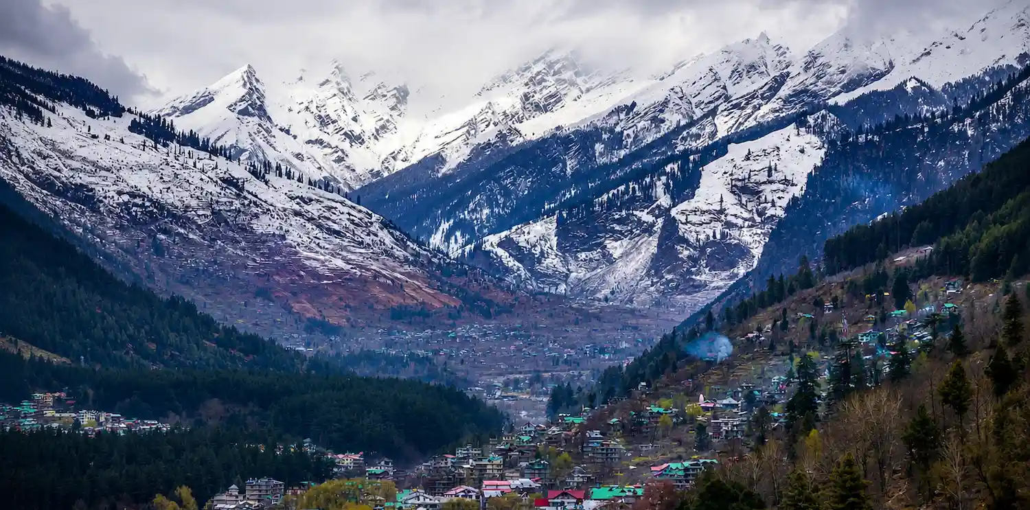 The Orchid Hotel Manali surrounded by Himalayan mountains and valley views