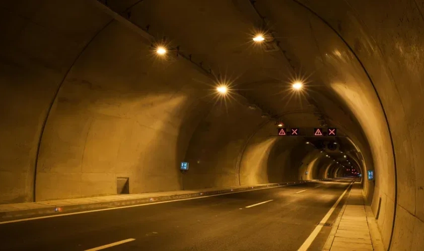 A tunnel with yellow lights