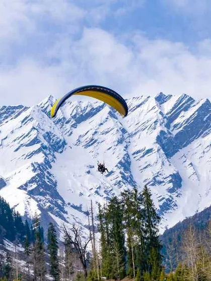 Solang Valley covered in snow with visitors enjoying winter sports