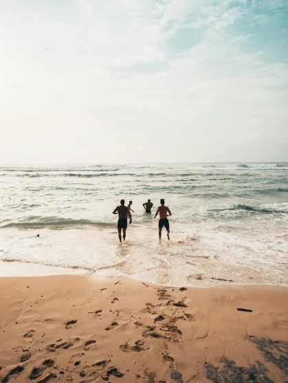 People standing near the shore on Juhu Beach