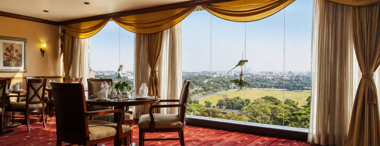 The Orchid Hotel Mumbai Vile Parle Dining Area With City Views Elegant dining area with panoramic city views at The Orchid Hotel Mumbai Vile Parle