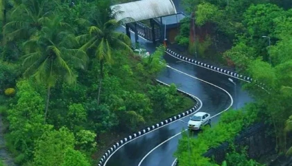 An ancient Indian temple surrounded by trees during daytime