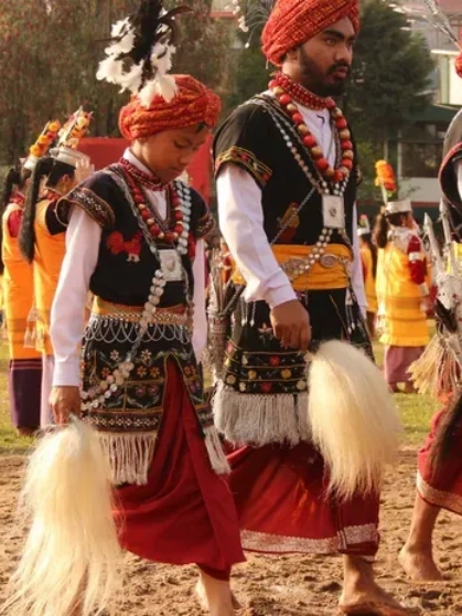 Tandem paragliding over snow-covered valleys near Shimla