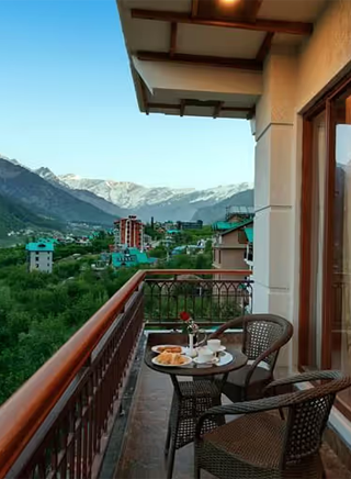Luxury hotel room in Manali offering stunning valley views and premium accommodation at Orchid Hotel