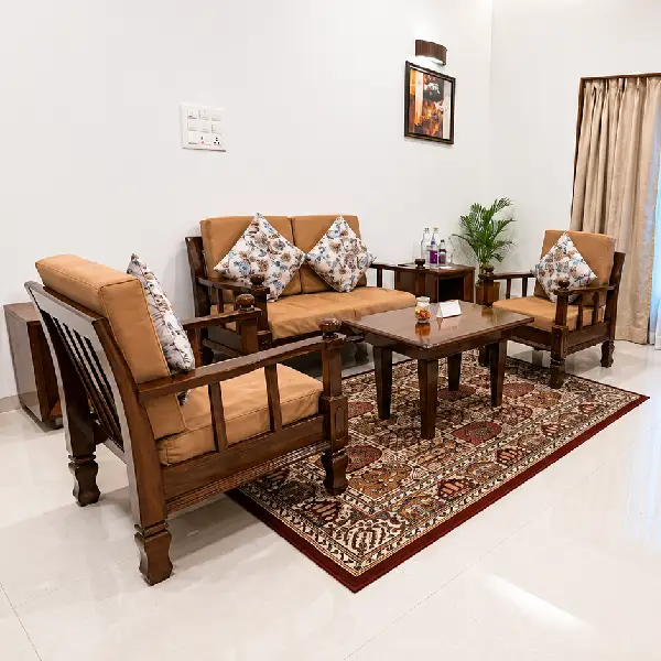 Living Room Seating Area Living room with wooden sofa set and patterned rug