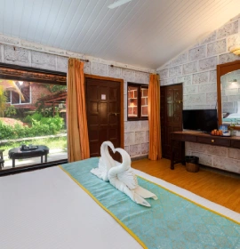 Konkan Cottage Interior with views of the garden and beach Konkan Cottage interior with beach and garden views at Lotus Eco Beach Resort