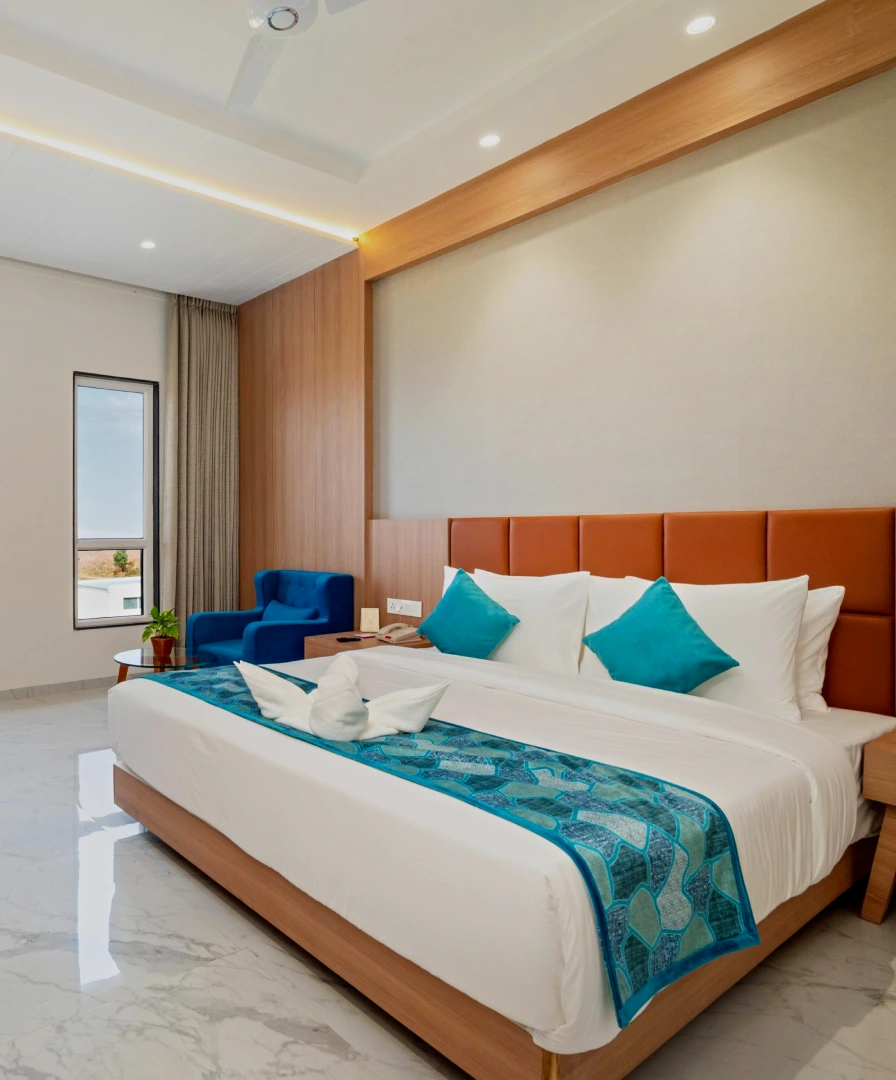 Deluxe King Room at The Orchid Hotel Jamnagar - Book Spacious Stay