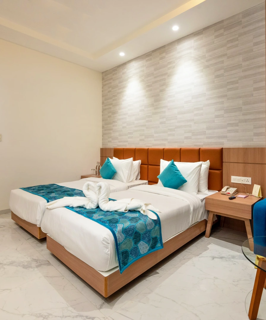 Twin Bed Deluxe Room at Orchid Hotel Jamnagar - Ideal for Business Stay