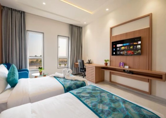Functional Twin Room for Business and Leisure Stays Desk and Twin Beds in Deluxe Room