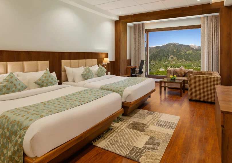 Premier Family Room with spacious layout and panoramic valley views at Orchid Hotel Manali, perfect for families