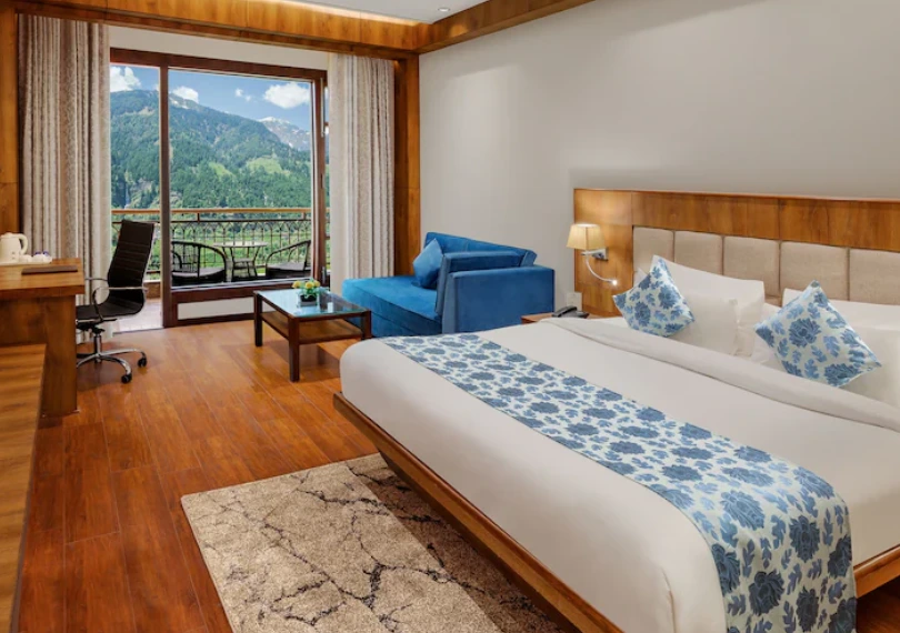 Premier Valley View Room with private balcony overlooking scenic valleys at Orchid Hotel Manali