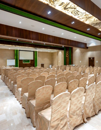 Event Hall Rear View – Orchid Hotel Panchgani Banquet Event hall rear view showing theatre seating, whiteboard, and projection screen at Orchid Hotel Panchgani