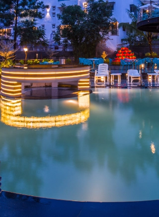 Outdoor swimming pool at Orchid Hotel Panchgani with valley views