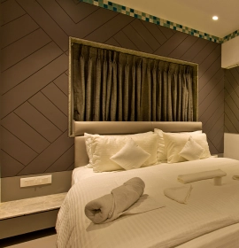 Stay in Queen-sized bed in Dew Drop Room at Orchid Hotel in Panchgani for comfortable family or romantic stays