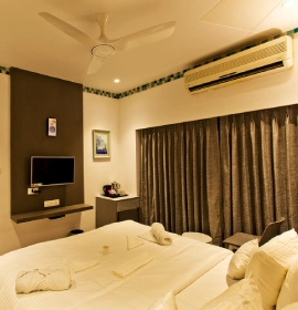 Modern amenities in Dew Drop Room Panchgani including high-speed Wi-Fi and flat-screen TV for guest convenience