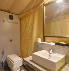 Forest Tent Bathroom with Vanity and Shower - Eco Resort Panchgani Forest Tent accommodation bathroom with modern vanity, toilet and shower at eco resort in Panchgani