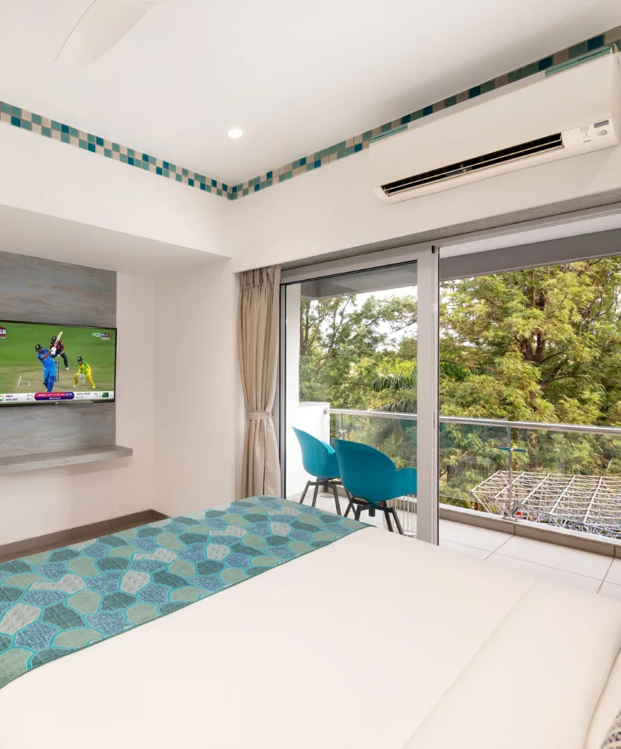 Dew Drop Mist balcony room at Orchid Hotel Panchgani with scenic hill view