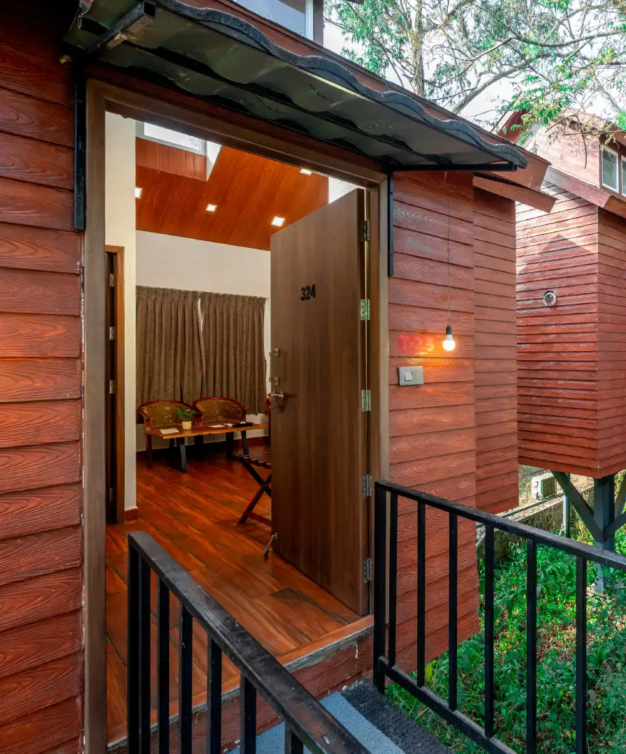 Tree House Suite at Orchid Hotel Panchgani with living area and sofa setup