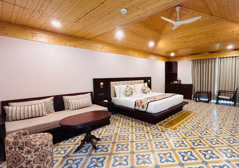 Book Prakruti Deluxe Room – Luxury Stay near Ganga, Orchid Hotel Rishikesh Prakruti Deluxe Hotel Room in Rishikesh at The Orchid Rishivan | Hotel near Byasi with River View