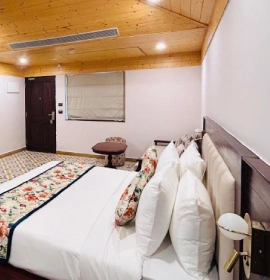 Prakruti Deluxe Room – Deluxe Room with Modern Amenities and Riverside View, Rishikesh Prakruti Deluxe Room with River and Garden View at Orchid Hotel Rishikesh